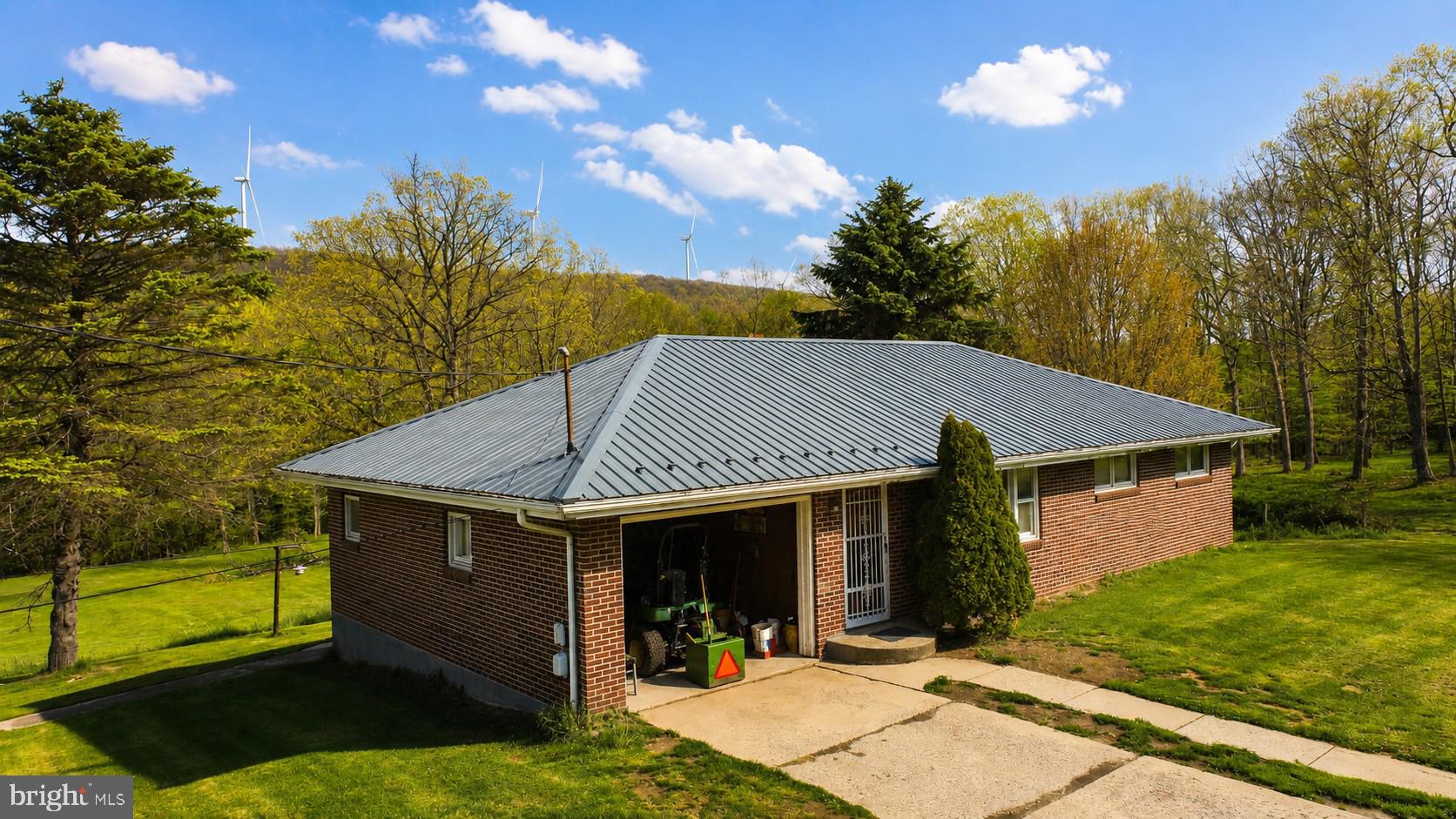 83 Bethlehem Road Oakland, MD 21550 - Photo 2 of 43 a view of a house with backyard porch and sitting area