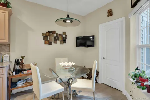 a living room with furniture and flat screen tv