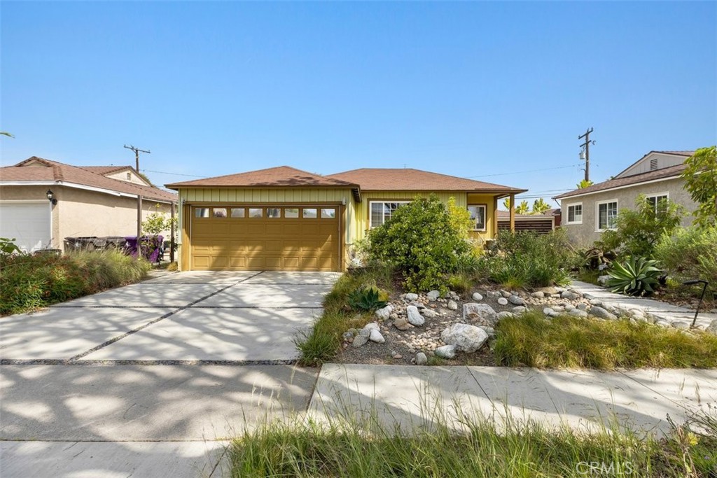 a sign board with buildings in the background