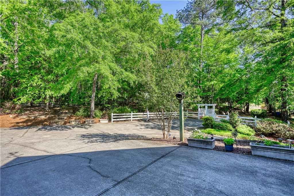 393 Edwards Road Oxford, GA 30054 - Photo 45 of 82 a backyard of a house with lots of green space