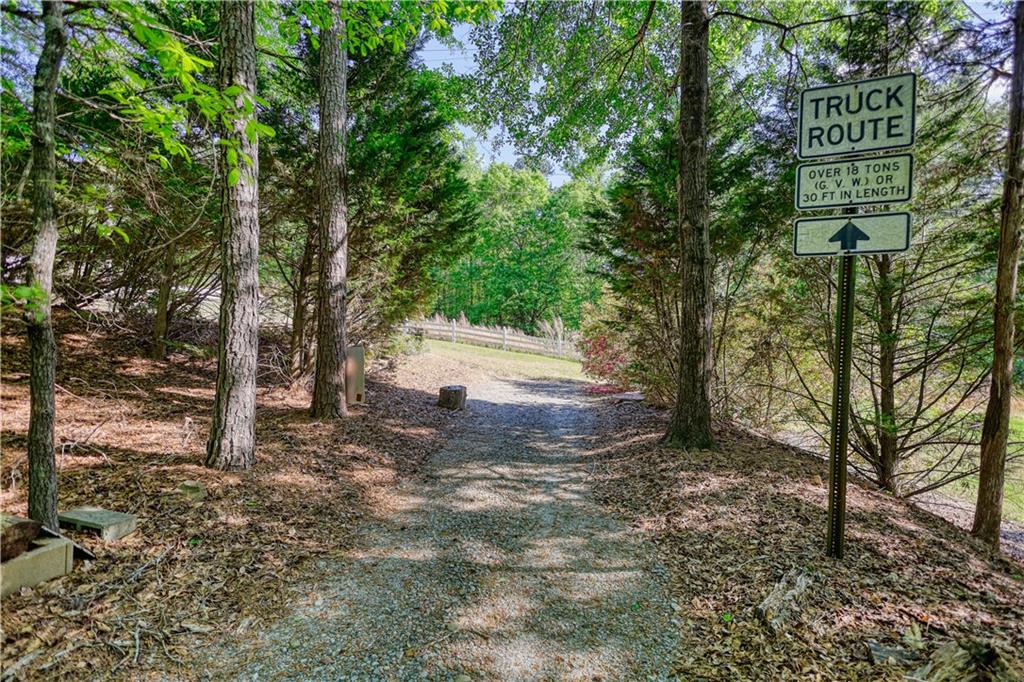393 Edwards Road Oxford, GA 30054 - Photo 57 of 82 a view of a yard with plants and trees
