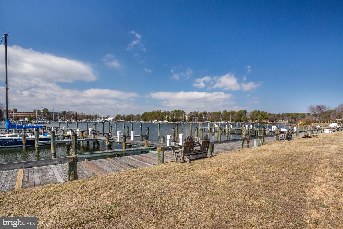 13824 Reef Way, Unit 301 Solomons, MD 20688 - Photo 1 of 64 Grab a bench and enjoy the sunshine by Back Creek