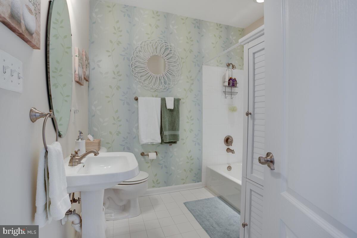 13824 Reef Way, Unit 301 Solomons, MD 20688 - Photo 28 of 64 Hall bath is spacious and has linin closet