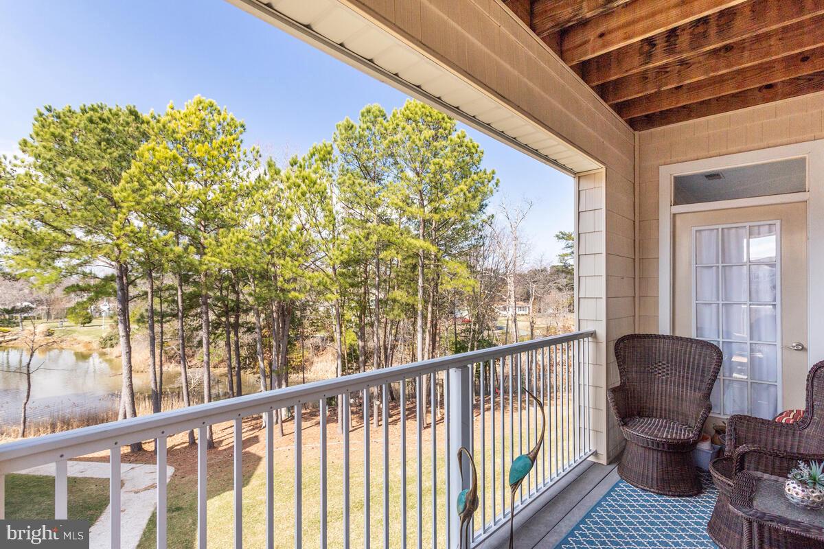 13824 Reef Way, Unit 301 Solomons, MD 20688 - Photo 4 of 64 Relax with water and wooded view