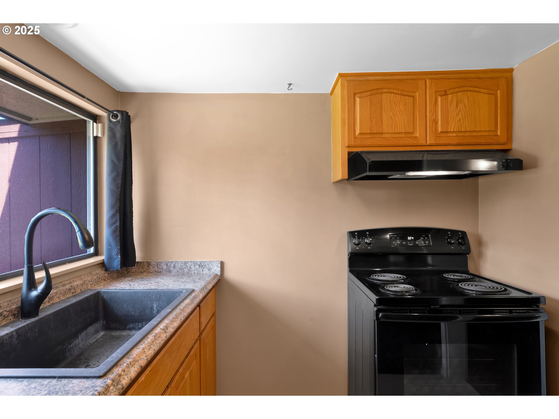 630 Colonial Drive Springfield, OR 97477 - Photo 15 of 37 a kitchen with granite countertop a stove and a sink