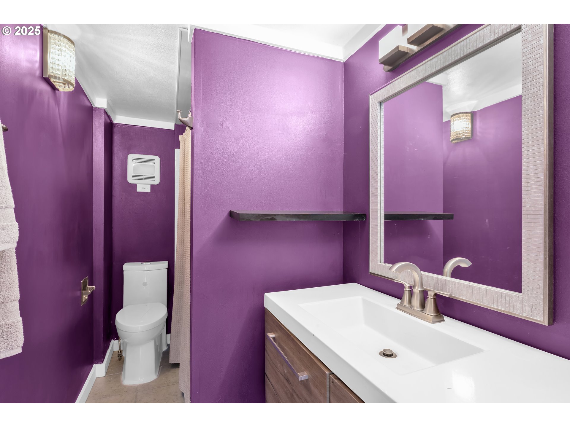 630 Colonial Drive Springfield, OR 97477 - Photo 23 of 37 a bathroom with a sink a toilet a mirror and vanity