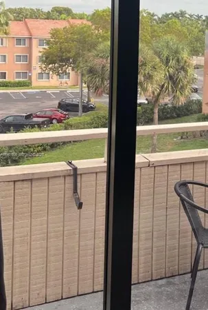 a view of a balcony with an ocean view