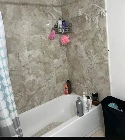 a bathroom with a bath tub