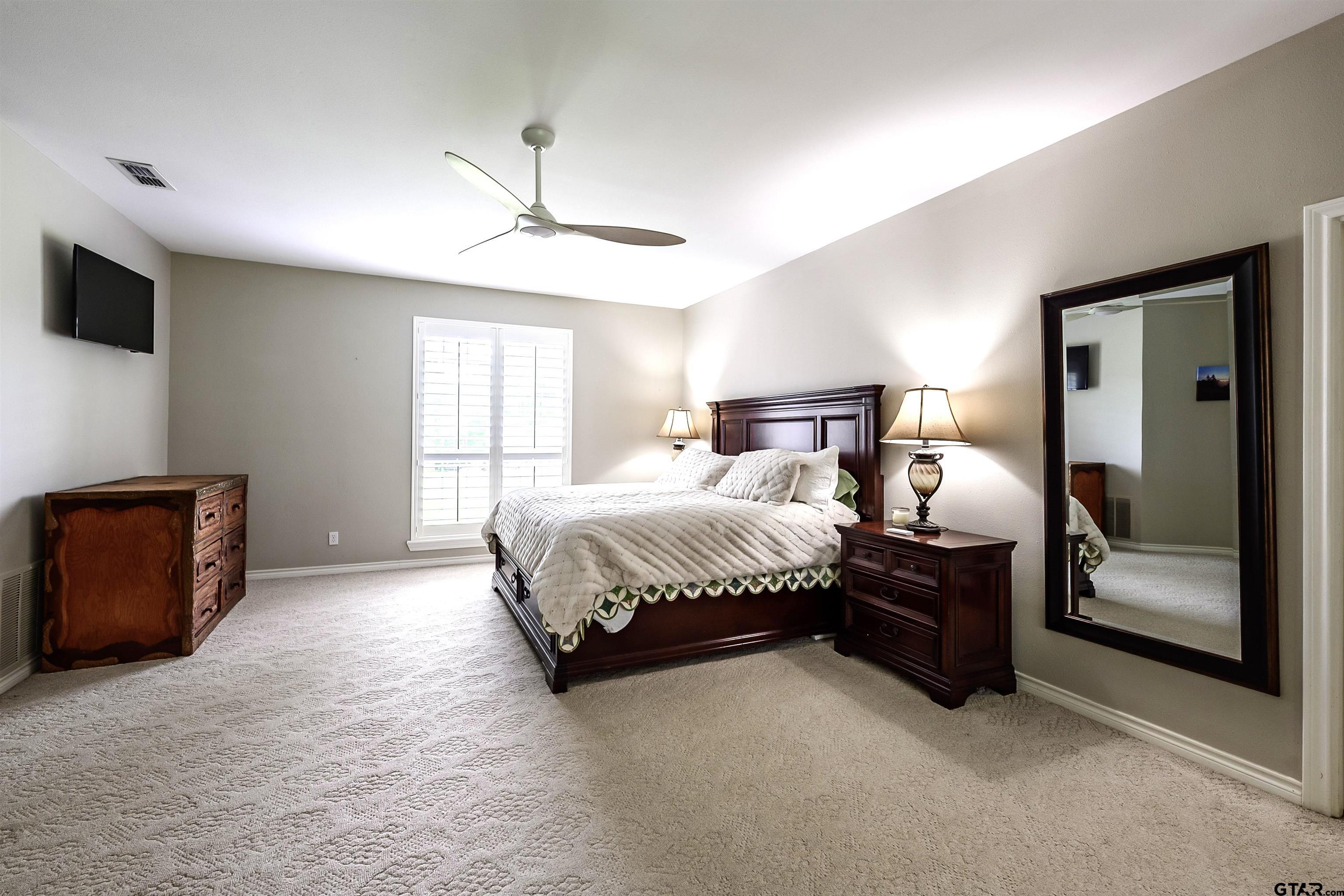10074 Hillside Lane Flint, TX 75762 - Photo 11 of 22 a bed room with a bed and a television