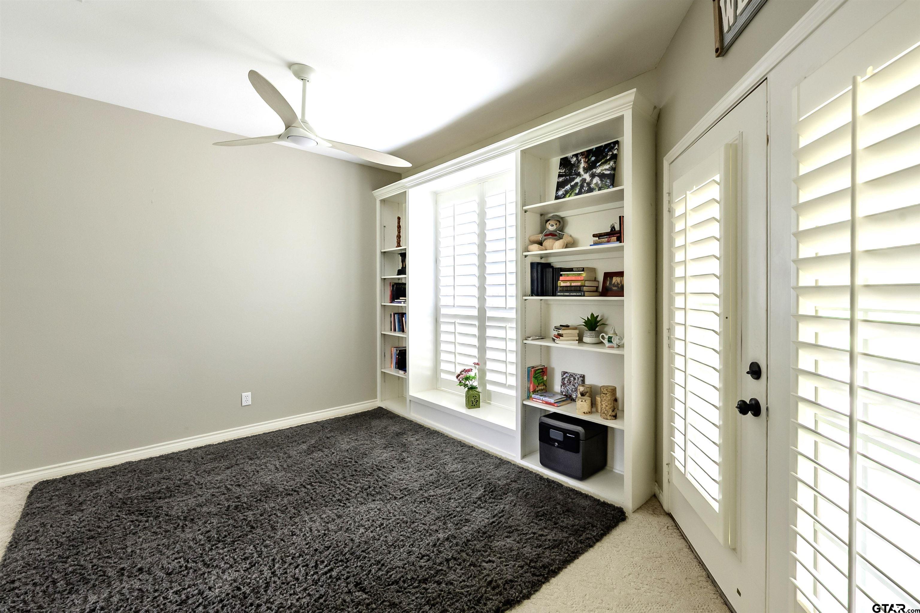 10074 Hillside Lane Flint, TX 75762 - Photo 13 of 22 a view of an empty room with kitchen and a window