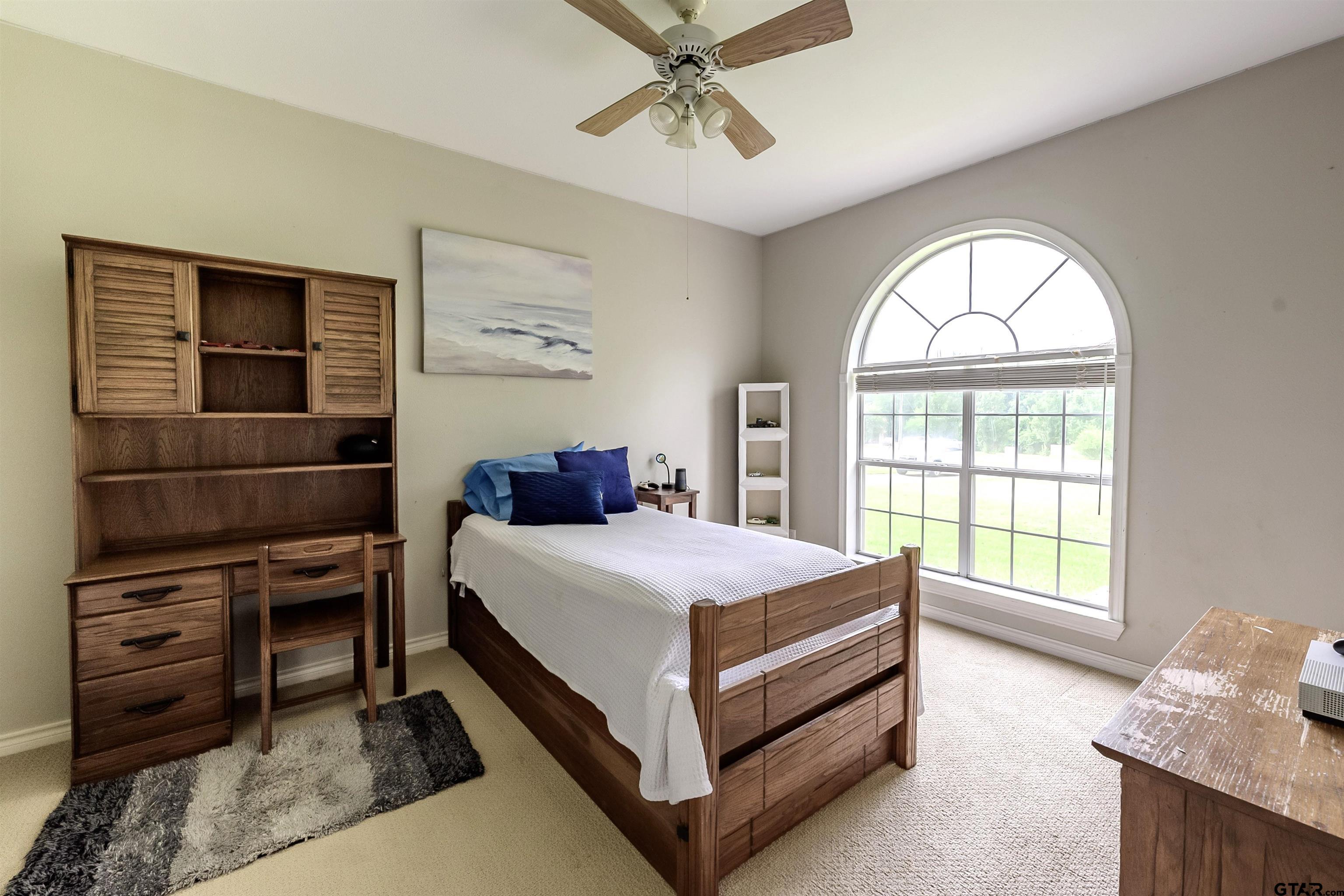 10074 Hillside Lane Flint, TX 75762 - Photo 18 of 22 a bed room with a bed and a window