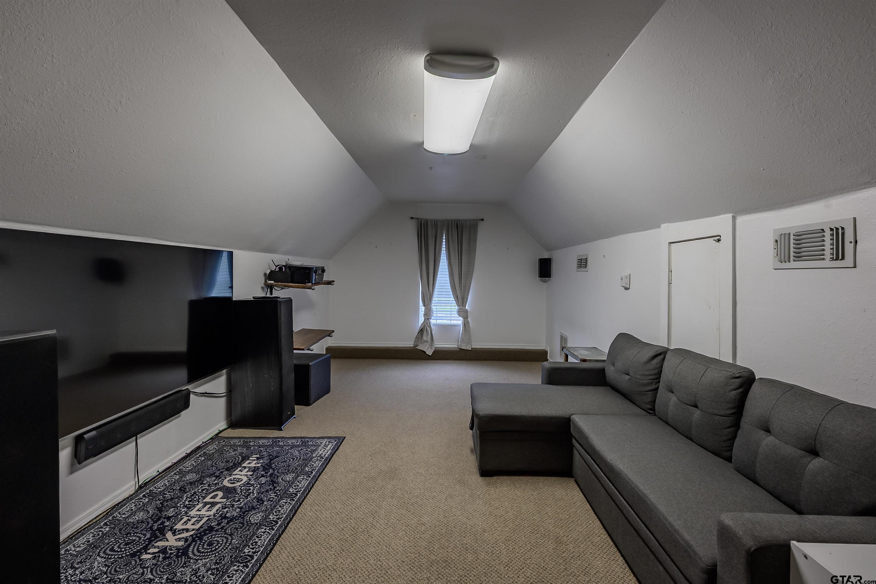 10074 Hillside Lane Flint, TX 75762 - Photo 22 of 22 a living room with furniture and a rug