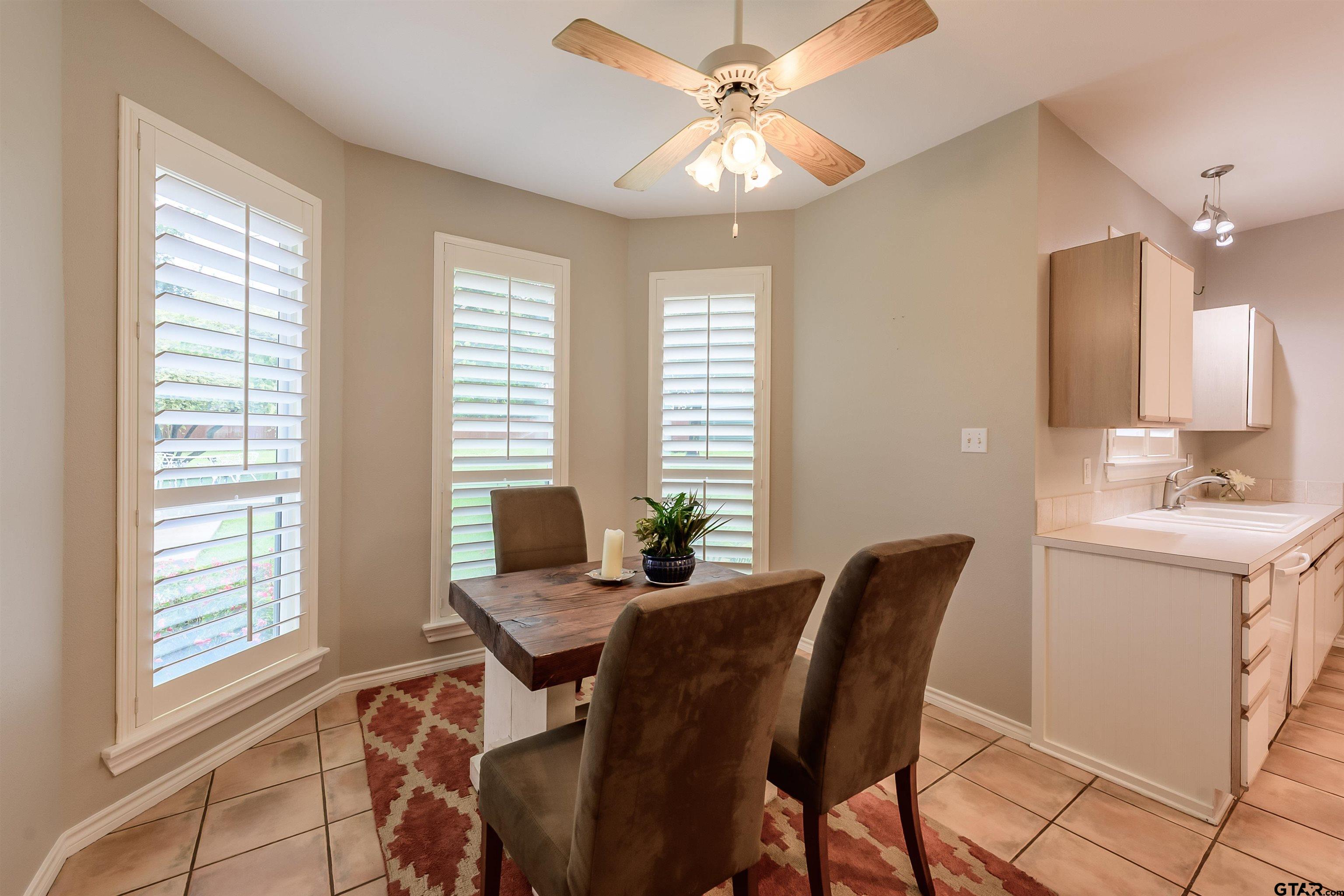 10074 Hillside Lane Flint, TX 75762 - Photo 9 of 22 a view of a dining room with furniture and windows
