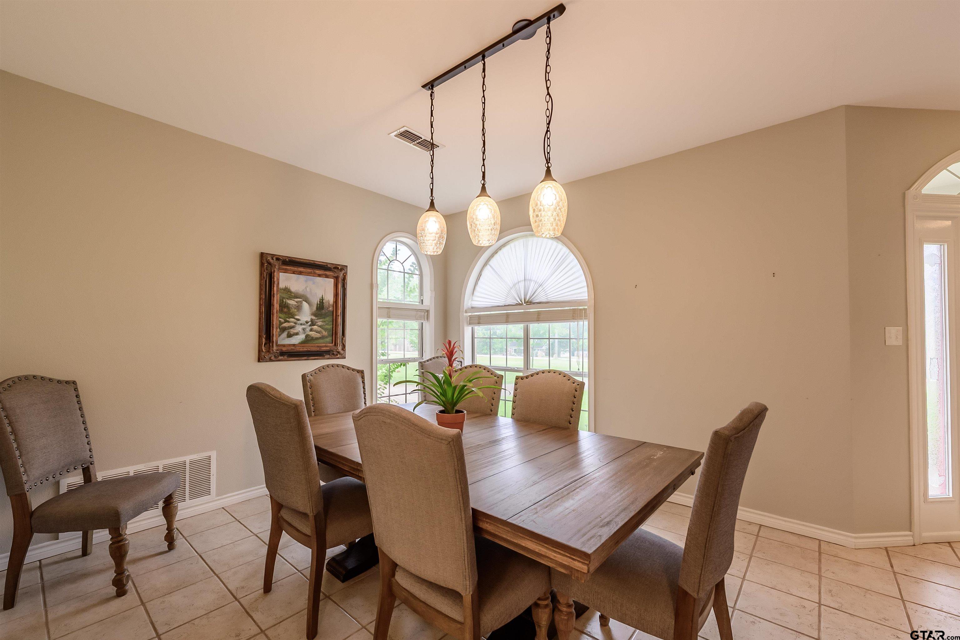 10074 Hillside Lane Flint, TX 75762 - Photo 10 of 22 a view of a dining room with furniture window and wooden floor