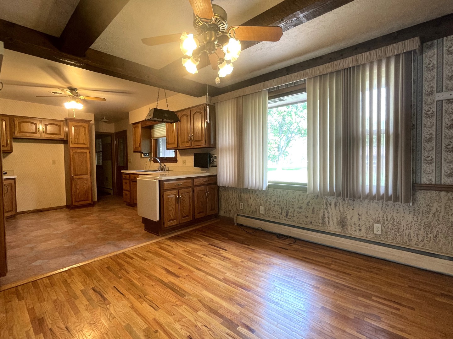 206 Palmyra Road Dixon, IL 61021 - Photo 11 of 46 a kitchen with stainless steel appliances granite countertop a stove a sink and a refrigerator