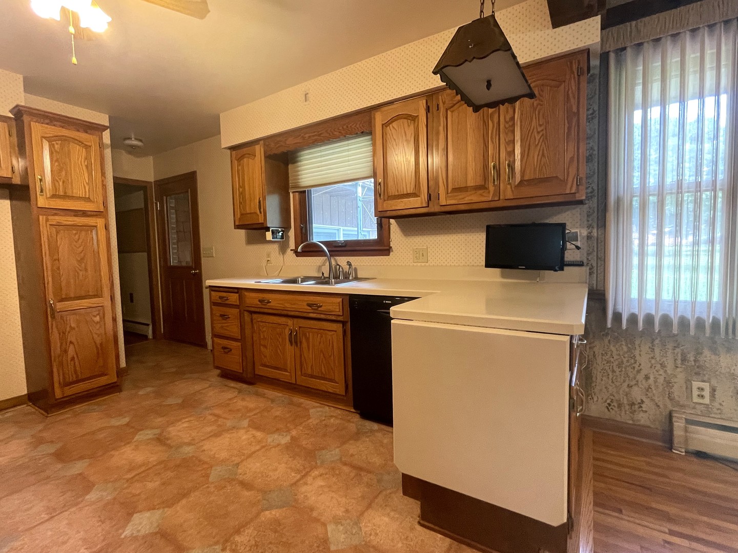 206 Palmyra Road Dixon, IL 61021 - Photo 14 of 46 a kitchen with stainless steel appliances a stove a refrigerator and cabinets