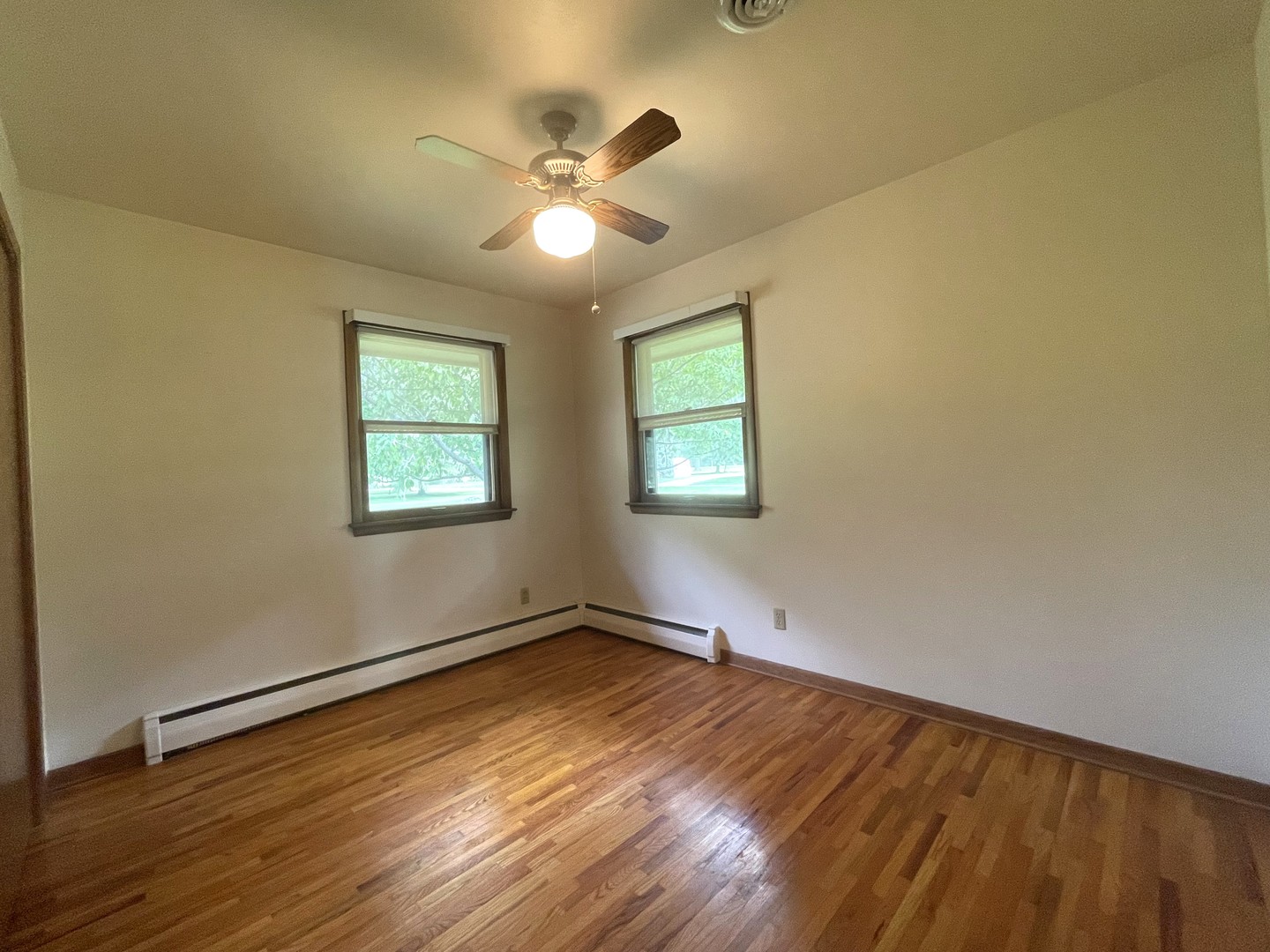 206 Palmyra Road Dixon, IL 61021 - Photo 18 of 46 a view of empty room with wooden floor and fan