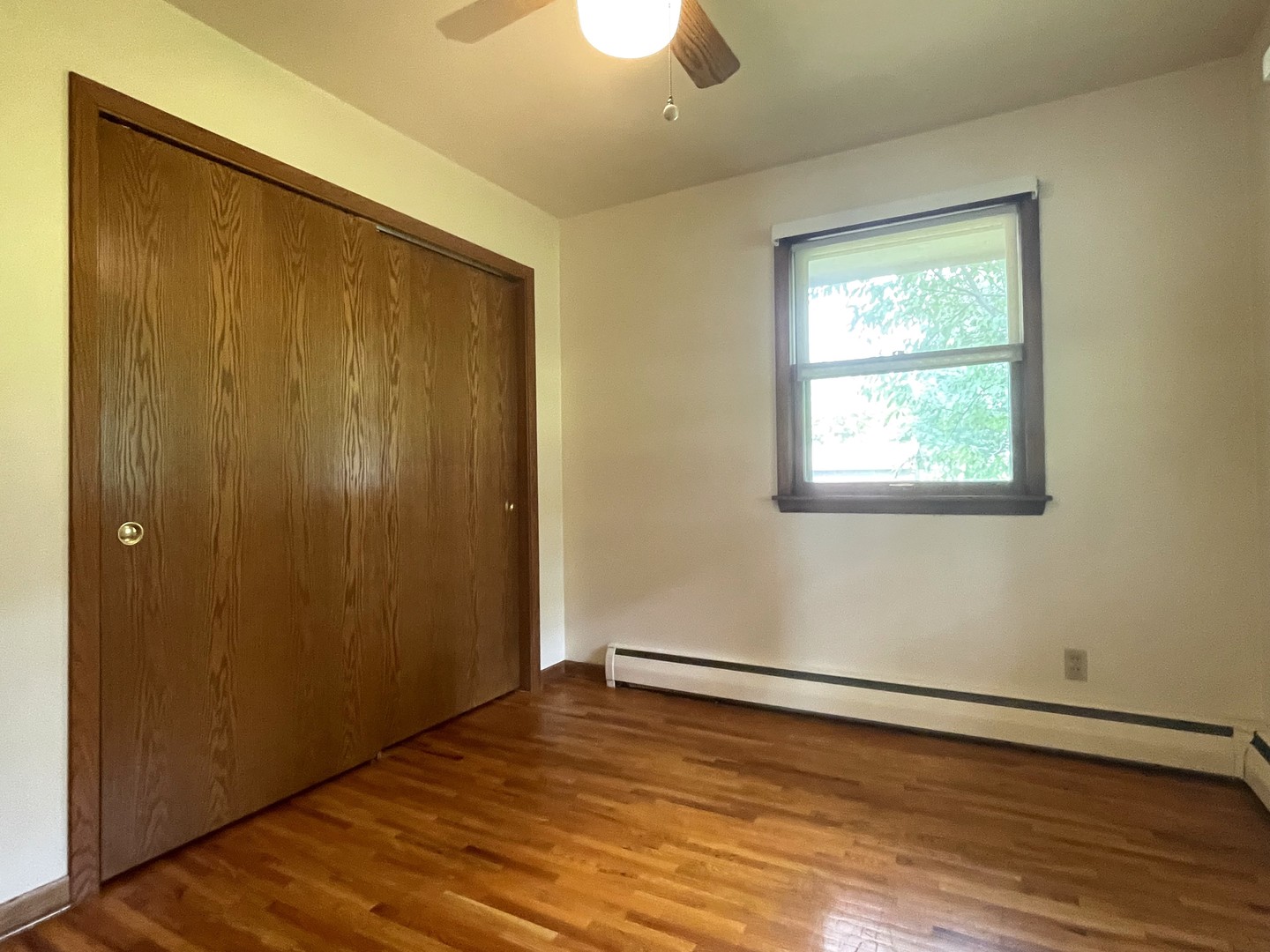 206 Palmyra Road Dixon, IL 61021 - Photo 19 of 46 a view of an empty room with wooden floor and a window