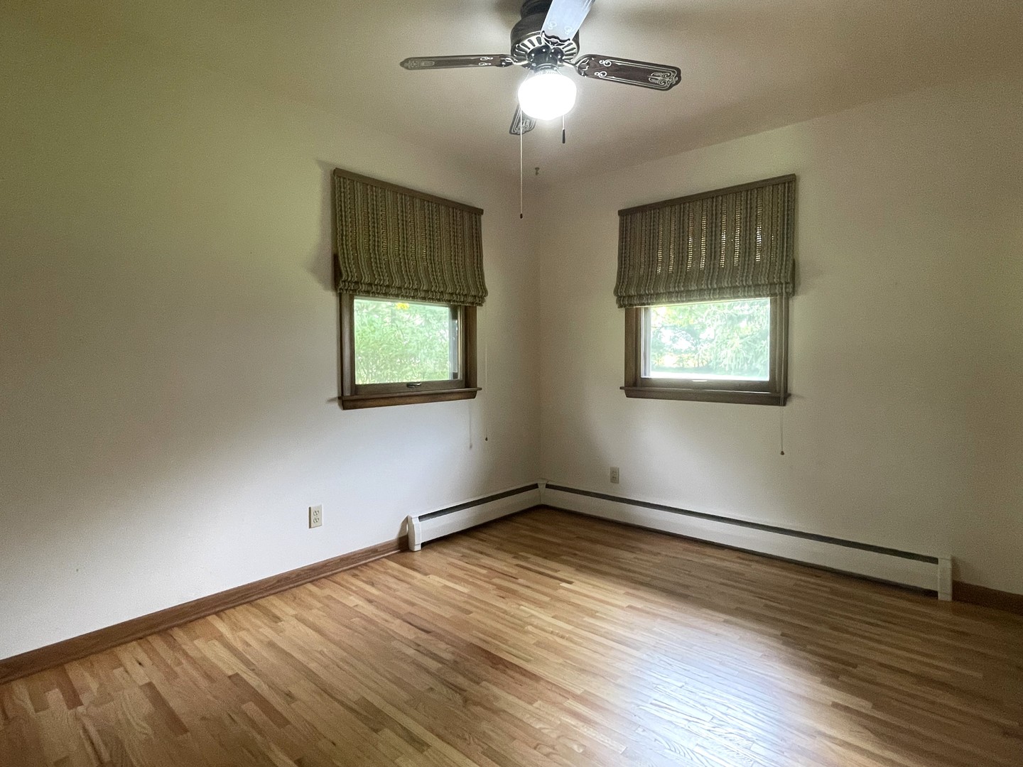 206 Palmyra Road Dixon, IL 61021 - Photo 20 of 46 a view of an empty room with wooden floor and a window