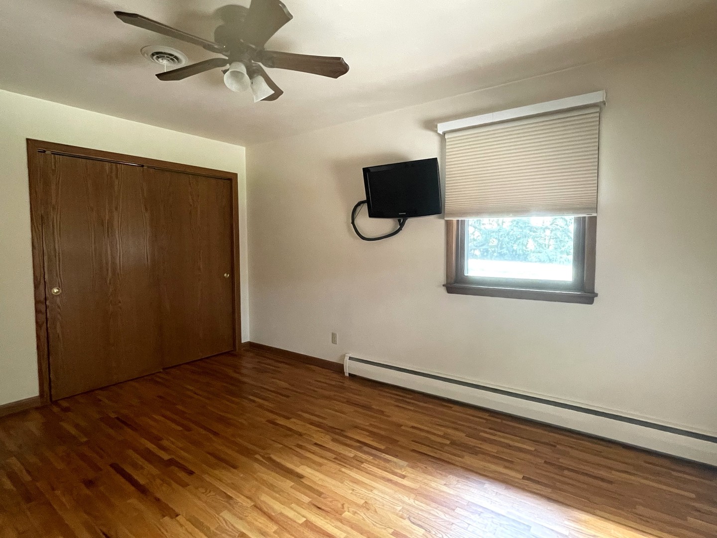 206 Palmyra Road Dixon, IL 61021 - Photo 24 of 46 a view of an empty room with wooden floor and a window