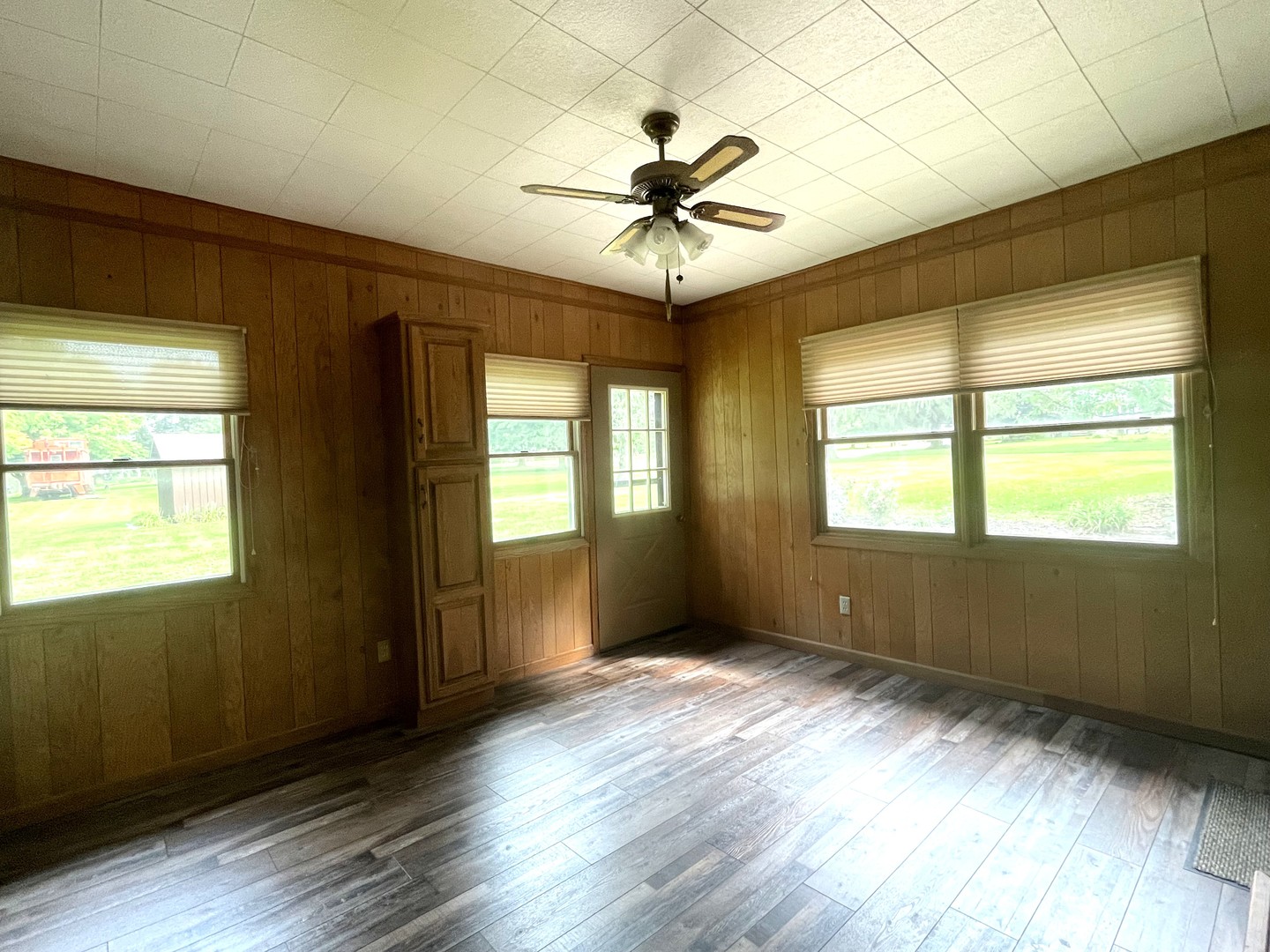 206 Palmyra Road Dixon, IL 61021 - Photo 28 of 46 a view of an empty room with wooden floor and a window