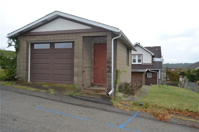 front view of a house and a yard