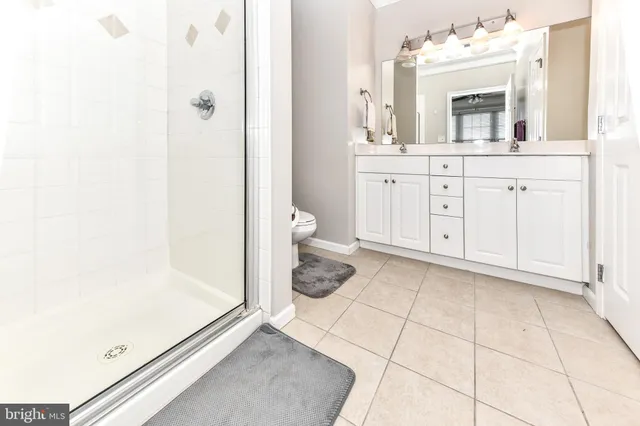 a bathroom with a shower and a sink