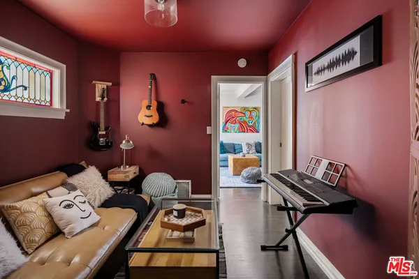 a room with furniture and wooden floor