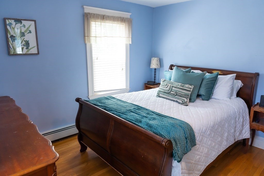 12 Newcastle Road Peabody, MA 01960 - Photo 18 of 35 a bedroom with a bed and a window