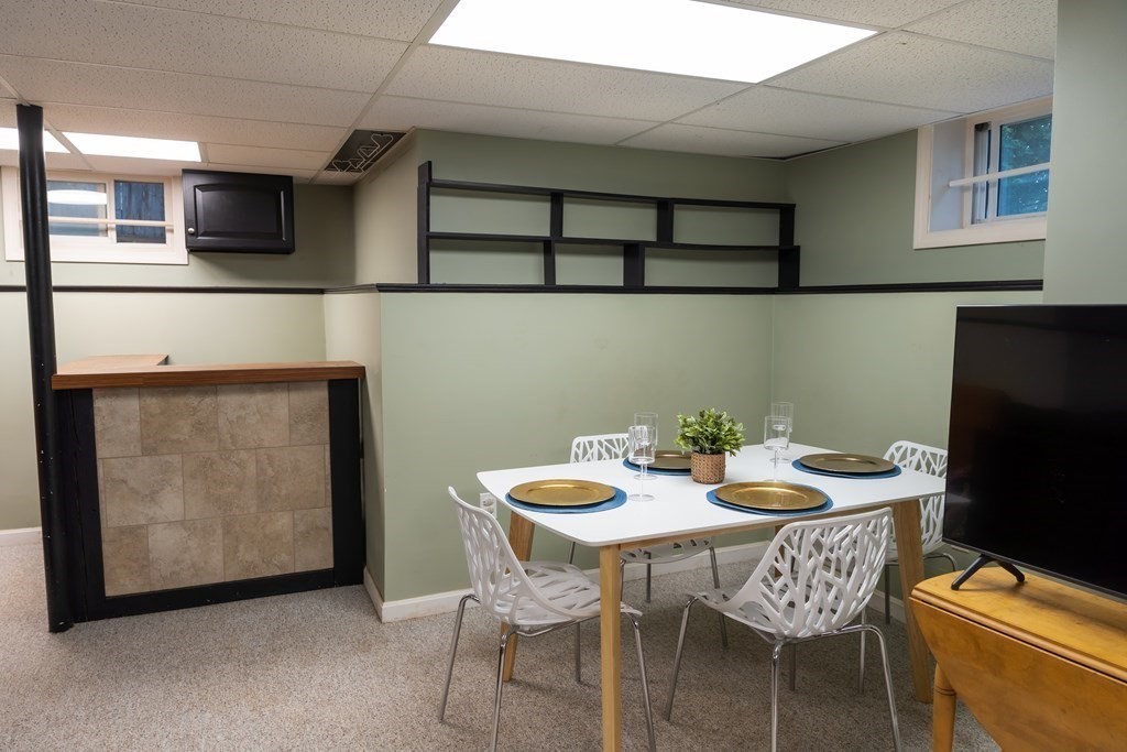 12 Newcastle Road Peabody, MA 01960 - Photo 27 of 35 a view of a dining room with furniture and wooden floor