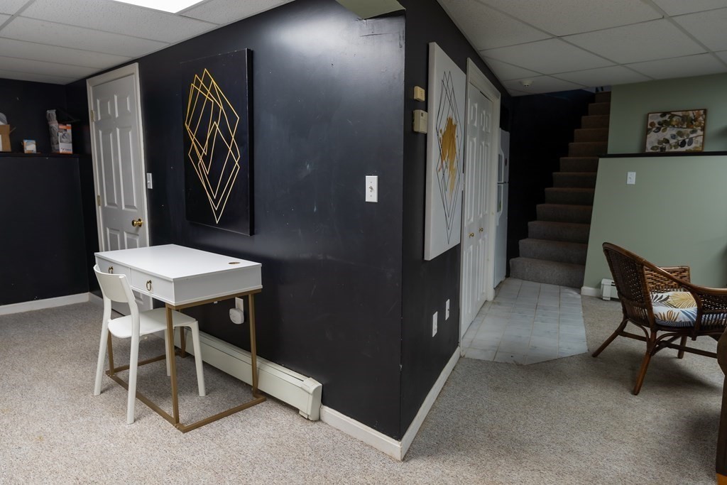 12 Newcastle Road Peabody, MA 01960 - Photo 28 of 35 a bathroom with a sink and a mirror