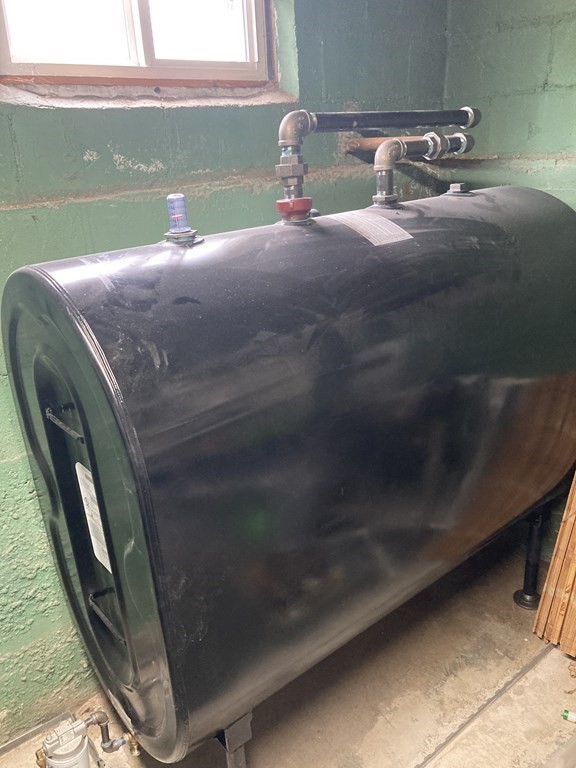 12 Newcastle Road Peabody, MA 01960 - Photo 35 of 35 a bedroom with a bed and a mirror