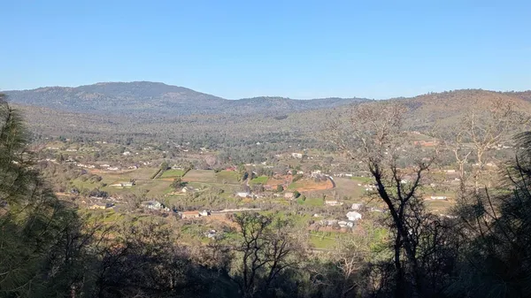 a view of mountain and tree