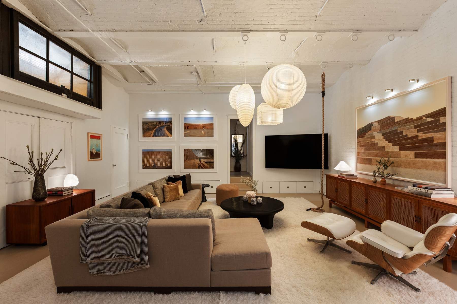 4 Staple Street Manhattan, NY 10013 - Photo 18 of 29 a living room with furniture a fireplace and a flat screen tv
