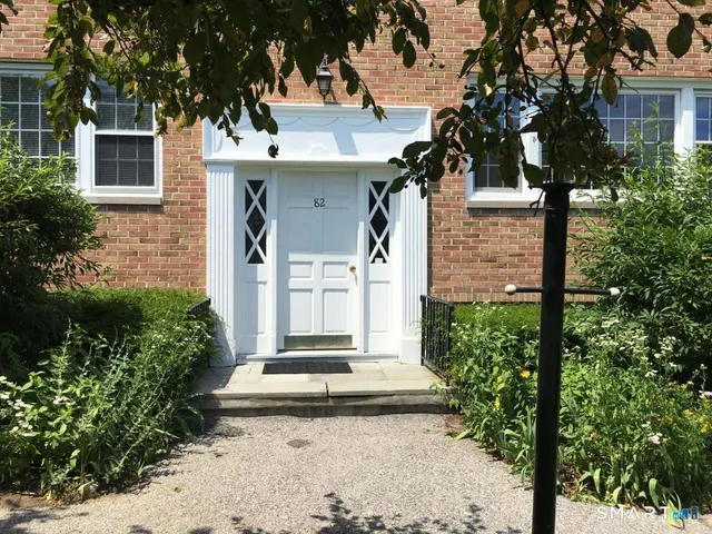 a bathroom with a sink toilet and a mirror