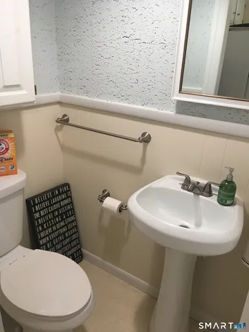 a view of a room with window wooden floor and chandelier