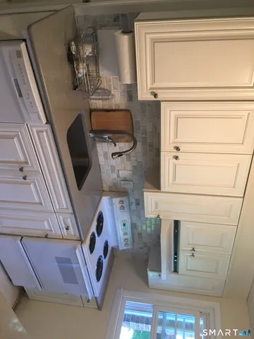 a view of kitchen and sink