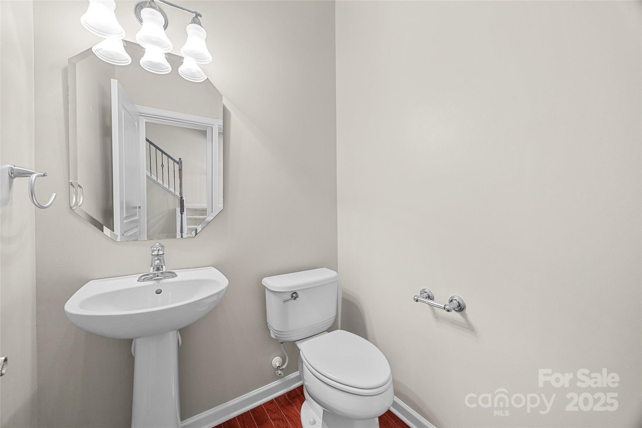 925 Lyndley Drive Fort Mill, SC 29708 - Photo 9 of 24 a bathroom with a toilet sink and mirror