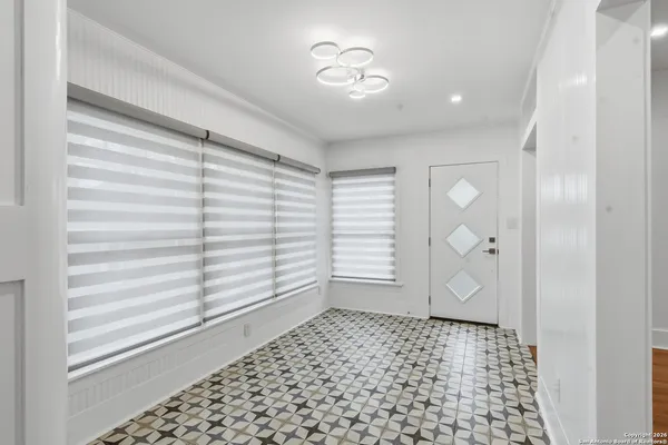 an empty room with a chandelier