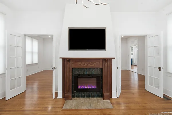 wooden floor in an empty room with a window