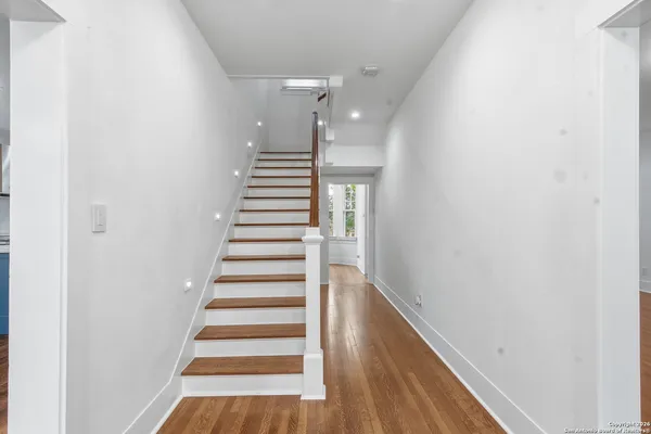 a bathroom with a shower and a sink