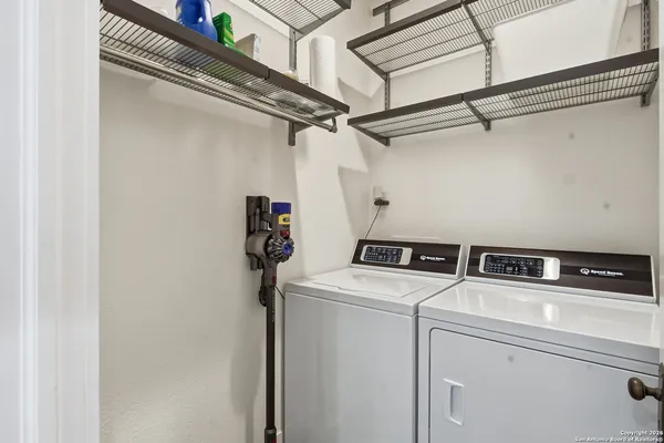 a bathroom with a shower toilet and sink