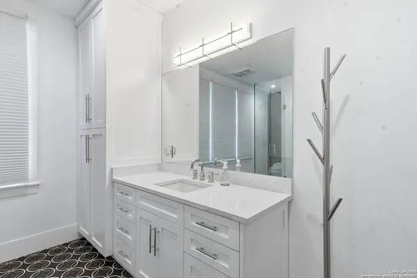 a white room with a table and chairs