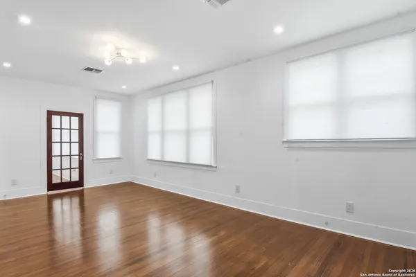 a living room with a fireplace and a flat screen tv