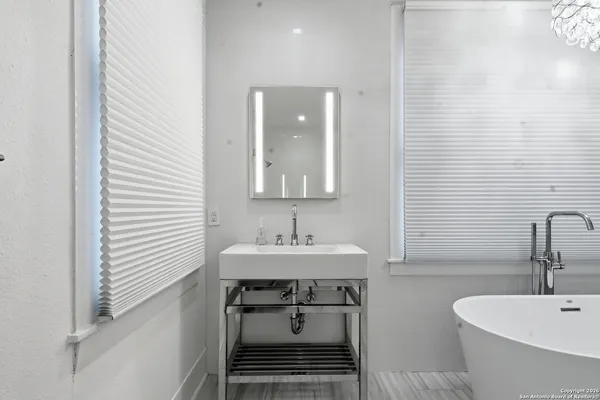 a front view of a house with a large window