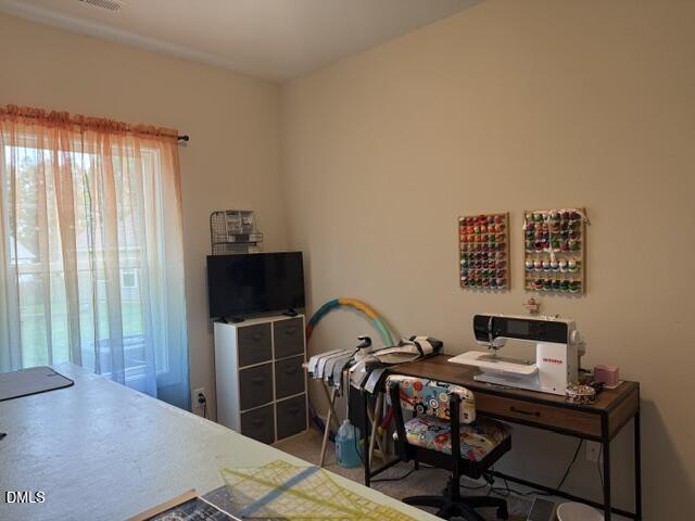 574 East Ridge Avenue Liberty, NC 27298 - Photo 14 of 28 a bedroom with a bed and a table in it