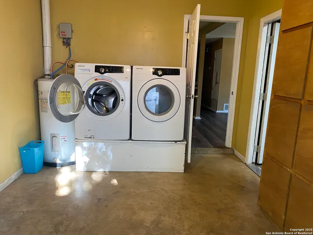 an empty room with large windows