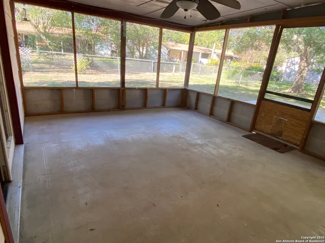 a view of a yard with a house and a tree