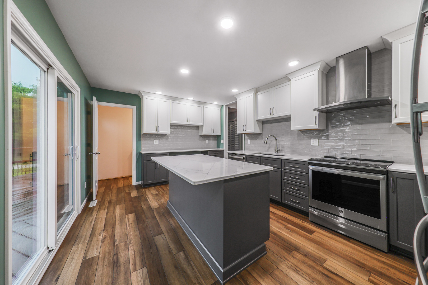 2433 East 2850th Road Marseilles, IL 61341 - Photo 7 of 20 a kitchen with stainless steel appliances granite countertop a stove a sink and a refrigerator