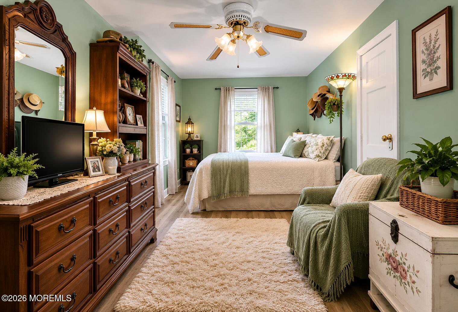 24 Foster Street Middletown, NJ 07701 - Photo 12 of 23 a bedroom with furniture and a flat screen tv